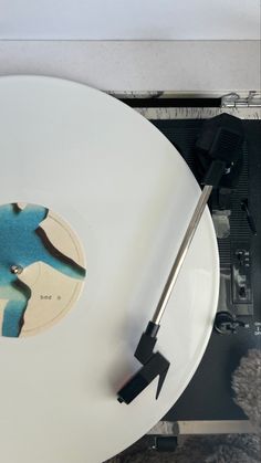 a white record player with a blue and black design on it