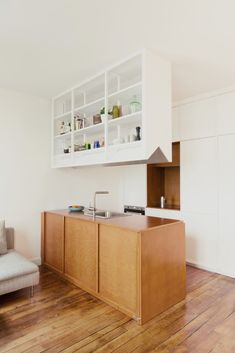 the kitchen is clean and ready to be used as a living room or dining area