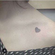 a woman's chest with a fingerprint in the shape of a heart on it