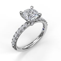 a diamond engagement ring on a white background