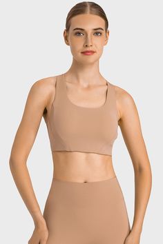 Highly Stretchy Cutout Racerback Sports Bra Stretch Sports Bra With Built-in Padding And Tank Straps, Solid Nylon Sports Bra With Built-in Bra, Contoured Sports Bra With Built-in Padding For Gym, Contoured Sports Bra With Built-in Bra For Yoga, Nylon Activewear With Built-in Bra, Solid Color Sports Bra With Built-in Bra, Racerback, Fitted Racerback Bra With Built-in Padding, Solid Compression Tank Top With Built-in Padding, Fitted Activewear With Built-in Padding And Tank Straps