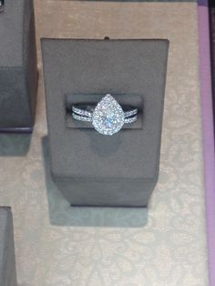 an engagement ring in a black box