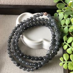 6mm Icy Wuji Black Jadeite Jade Bead Bracelet Necklace Jade Measurement: Approximately 6 mm. Bracelet is adjustable to fit any size. Shape and Cut: Round Color: Black Wuji Type: Icy Comments: All natural texture. Flawless item. Photos cannot show how icy the bracelet or necklace. Looks very translucent and moist. CERTIFICATION All of our items come with their own certificate guaranteeing Type A Jadeite. The Jade Laboratory is a famous gem lab where gems are evaluated by a professional with a det Luxury Jade Jewelry With 108 Beads, Spiritual Single Strand Bracelet With Round Beads, Spiritual Single Strand Bracelet, Jade Bead Bracelet, Cabochon Ring, Jade Bracelet, Pretty Bracelets, Gorgeous Bracelet, Jade Beads