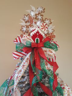 a decorated christmas tree with gingerbreads and candy canes