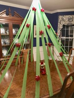 a christmas tree made out of green ribbon