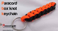 an orange and black paracord keychain on a white background with the text paracord box knot keychain