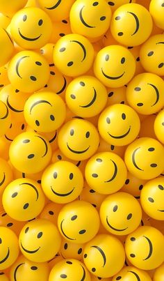 many yellow balls with smiley faces on them