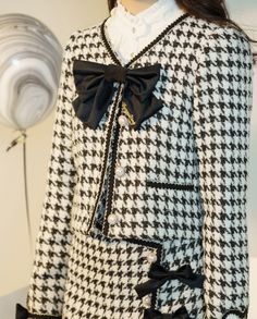 Features: It features v-neck with bowknot front, long sleeves, heart-shaped patches on the cuffs, placket with four pearl buttons, short jacket. High waist, A-line short skirt.  Attention: This price includes a jacket or a skirt only, others are not included.   Size Chart of Jacket:  Size (CM): Unit CM; Sizes below are measured in flat-laid position, hand measurement will have discrepancy of about 2 CM.   	 		 			Size(cm) 			S 			M 			L 			XL 			XXL 		 		 			Bust 			90 			94 			98 			106 			110 Elegant Long Sleeve Outerwear With Bow, Elegant Bow Outerwear For Spring, Elegant Spring Outerwear With Bow, Fall Party Outerwear With Bow, Lover Black And White, Skirt Straight, Checkered Jacket, Elegant Jacket, Plaid Ribbon