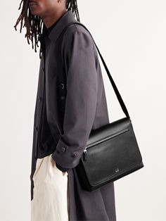 Having easy access to your goods and chattels can be a lifesaver, and Dunhill's design team gets it. Made in Italy, this full-grain leather 'Cadogan' messenger bag features an adjustable shoulder strap, an open compartment with two pockets and magnetic flap closure at the front. Designer Soft Leather Flap Bag For Business, Designer Leather Flap Bag For Business, Designer Business Saddle Bag Satchel, Modern Soft Leather Business Saddle Bag, Modern Soft Leather Saddle Bag For Business, Business Crossbody Flap Bag With Smooth Grain, Timeless Business Flap Bag With Smooth Grain, Timeless Smooth Grain Flap Bag For Business, Designer Smooth Grain Shoulder Bag For Business