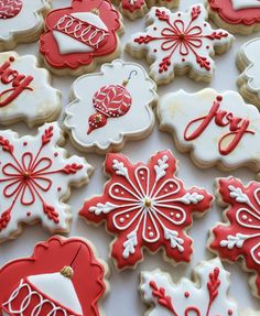 many decorated cookies are displayed on a table