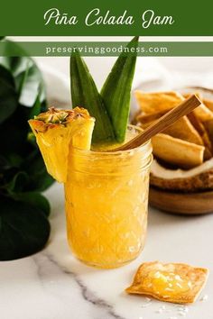 pina colada jam in a jar with pineapple garnishes on the side