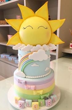 a cake that is sitting on top of a table with the sun in the middle