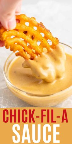 a person dipping cheese into a sauce in a glass bowl with the words chicken - fil - a sauce on it