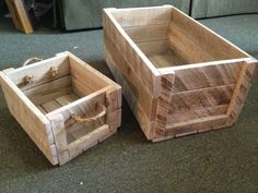 two wooden boxes sitting next to each other on the floor