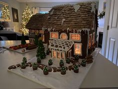 a gingerbread house decorated with christmas decorations