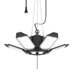 an overhead light fixture with three lights hanging from it's sides and two lamps attached to the ceiling