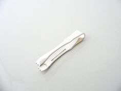 two toothbrushes sitting on top of a white surface