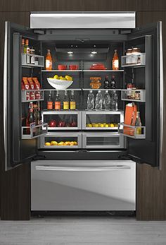 an open refrigerator with food and drinks in it