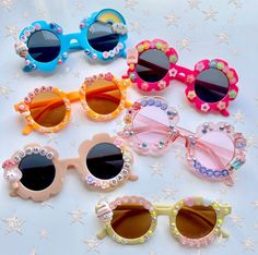 Whimsy Rays presents our "SunHaze" collection featuring our ever adorable & fully customizable sunnies. Adorn in beautiful gems & pearls with charm accents, your little girl is set to be the tiniest trendsetter in these super cute & personalized shades!  Our shades make the perfect gift for birthdays, party favors, special events, baby showers, photoshoots, holidays, slumber parties, beach trips & so much more! ☆ ☆ ☆ ☆ ☆ HOW TO ORDER: 1.) Choose the color of your sunnies 2.) Select your style (i Cute Summer Sunglasses With Glass Material, Cute Glass Sunglasses For Summer, Fun Beach Sunglasses With Glass Lenses, Novelty Plastic Sunglasses For Summer, Novelty Sunglasses For Summer, Plastic Sunglasses With Polarized Lenses As Gift, Plastic Polarized Sunglasses As Gift, Whimsical Sunglasses With Uv Protection For Beach, Whimsical Beach Sunglasses With Uv Protection