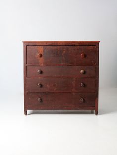 an old wooden dresser with three drawers