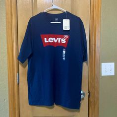 Brand New With Tag Never Worn Levi's Blue Shirt For Fall, Levi's Cotton Crew Neck Shirt, Levi's Logo Print Crew Neck Top, Levi's Red Crew Neck Top, Levi's Relaxed Fit Top With Logo Print, Levi's Blue Crew Neck Tops, Levi's Short Sleeve Letter Print Tops, Levi's Blue Cotton Shirt, Levi's Short Sleeve Tops With Letter Print