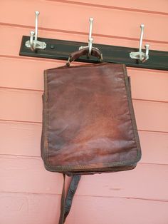 * Poetic Earth reddish/brown waxed leather backpack/crossbody bag. * Measures 11" x 9" x 3" * One zippered compartment and two open areas. * Adjustable straps. * One of the interior snaps is missing. Photo. * Light wear. Smoke free home. Vintage Satchel Backpack For On-the-go, Vintage Brown Backpack For On-the-go, Vintage Leather Shoulder Backpack For School, Vintage Leather Shoulder Backpack For Everyday Use, Vintage Leather Satchel Backpack For Everyday, Vintage Leather Backpack With Adjustable Strap For Everyday, Vintage Brown Leather Backpack For Everyday, Vintage Rectangular Leather Backpack For Daily Use, Vintage Rectangular Backpack With Leather Lining