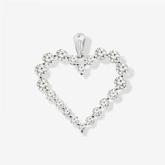 Love conquers all with this charming, graduated, pinpoint-set diamond heart pendant. Meticulously handcrafted in 14k white gold, it features 20 round brilliant-cut diamonds and is the perfect romantic gift. Curate an eye-catching statement look by matching this with some of the other natural beauties from our Diamond Jewelry Collection. Natural Diamonds: 0.90ctw 14K White Length: 3/4 Inch Love Conquers All, Heart Pendant Diamond, Romantic Gift, Diamond Heart, Round Brilliant Cut Diamond, Brilliant Cut Diamond, Round Brilliant, Prong Setting, Heart Pendant