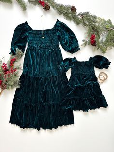 ITEM DESCRIPTION Embrace stunning style with our matching velvet mommy and me dresses. Soft to touch and comfortable to wear. You'll look and feel like a million bucks without breaking the bank! • Fit Type: True to Size• Fit Style: Long Tiered Dress Flowy• Length: Calf Long Dress• Material: Velvet, 95% Polyester 5% Spandex• No zipper• This dress includes lining• Front and back smocked bodice* Accessories not included. SIZING ADULT S: Chest 30" | Waist 24.4"| Length: 39.8"| Sleeve length: 15" M: Chest 31.5" | Waist 26.4"| Length: 40.7"| Sleeve length: 15.3" L: Chest 33" | Waist 28.4"| Length: 41.3"| Sleeve length: 15.6" XL: Chest 34.5" | Waist 24.4"| Length: 42"|Sleeve length: 15.9" KIDS 6-9 Months: Chest 15" | Waist 16.6"| Length: 16.9"| Sleeve length: 7.3" 12-18 Months: Chest 17.5" | Wais Mommy And Me Christmas Outfits, Mommy And Me Christmas, Long Tiered Dress, Mother Daughter Dresses Matching, Mom And Daughter Matching, Mommy And Me Dresses, Stunning Style, Dress Flowy, Mommy And Me Outfits