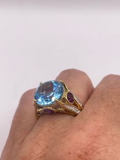 Vintage cocktail ring. Huge great color blue topaz stone  surrounding  setting is handcrafted in 925 sterling silver  Size  6.5 Can be sized, my jeweler charges $20  All rings are shipped free in the US in a nice gift box.   Check out our over a THOUSAND great reviews Engraving is $4 per letter and is not always perfect depending on the piece. It can take a few days if the jeweler is busy. This is payable to Paypal Judithsltd@gmail.com  PLEASE NOTE If we have multiples of the same vintage item, Luxury Blue Topaz Gemstone With Accent Stones, Luxury Blue Amethyst Ring, Luxury Hallmarked Blue Topaz Ring, Formal Multi-stone Topaz Ring With Round Cut, Luxury Multi-stone Blue Topaz Gemstones, Luxury Blue Topaz Rings With Gemstone Accents, Luxury Round Topaz Gemstone Ring, Luxury Blue Topaz Multi-stone Ring, Oval Multi-stone Blue Topaz Ring