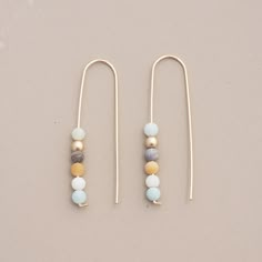 "Inspired by ascension, these climbing matte finish Amazonite beads are suspended on 14k gold fill hook earrings. Earthy and elegant, the nature of these beads lends each pair its own unique color palette, reminiscent of tiny celestial bodies. 2\" drop 14k gold fill ear wires" Homemade Jewelry, Diy Schmuck, Bijoux Diy, Beaded Jewelry Diy, Jewelry Creation, Jewelry Projects, Jewelry Tutorials, Diy Earrings, Hook Earrings