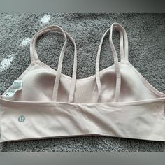 Never Worn. Brand New. Pale Pink Lululemon Size 8 Bra. Pink Activewear With Built-in Bra For Relaxation, Pink Stretch Sports Bra For Relaxation, Pink Activewear With Built-in Bra, Pink Lululemon, Pink Bra, Sports Bras, Pale Pink, Women's Intimates, Lululemon Athletica