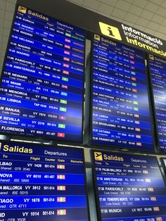 an airport departure board with multiple destinations on it's sides and the names of all airlines