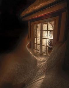 an open window in a dark room with snow on the ground and sunlight streaming through it