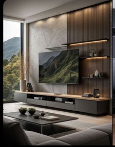 a living room with a large screen tv on the wall and a coffee table in front of it