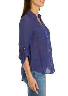 This woven top from A. Byer is designed with a preppy collar and practical roll-tab sleeves. | A. Byer Women's Portofino Woven Top, Medium Blue Casual Tops With Cuffed Sleeves, Casual Blue Tops With Cuffed Sleeves, Summer Tops With Button Closure And Fold Down Collar, Blue Tops With Cuffed Sleeves For Fall, Trendy Collared Tops With Button Cuffs, Summer Casual Blouse With Fold Down Collar, Casual Summer Blouse With Fold Down Collar, Preppy Collared Relaxed Fit Tops, Casual Tops With Placket And Fold-down Collar