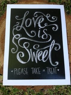 a black and white photo with the words love is sweet written in chalk on it