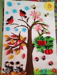 an apple tree made out of paper with birds and flowers on it