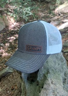 "GRAMPY Patch on our premium OTTO CAP 6 panel structured adjustable snapback low profile trucker hat. GRAMPY adjustable snapback \"OSFM\" so one size should fit your Grandpa! The perfect gift for any Grandpa! 6 Panel Premium Structured low profile Snapback Trucker Hat: Fabric: Cotton-Poly/Nylon Mesh Size: Adjustable Snapback One Size Fits Most Washing instructions; Hand wash cold only, wipe dirty areas only with a damp cloth, do not submerse hat in water, do not wet the patch area at all. Do not Gray Adjustable Snapback Trucker Hat, Gray Snapback Trucker Hat One Size, Gray Snapback Trucker Hat, Adjustable Gray Trucker Hat, Adjustable Gray Trucker Hat With Letter Print, Gray Snapback Trucker Hat With Letter Print, Gray Trucker Hat, One Size Fits Most, Gray Trucker Hat One Size Fits Most, Gifts For Grandpa