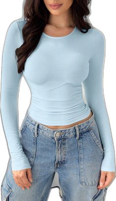 Light Blue Long Sleeve Winter Top, Light Blue Long Sleeve Top For Winter, Fitted Light Blue Winter Tops, Fitted Light Blue Top For Winter, Fitted Light Blue Tops For Winter, Fitted Light Blue Long Sleeve Top, Light Blue Fitted Tops For Fall, Light Blue Long Sleeve Stretch Top, Light Blue Stretch Tops With Solid Color