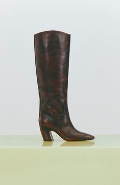 A minimalist design brings wardrobe-spanning versatility to this leather knee-high boot framed with a snipped toe and sculptural setback heel. 3" heel 15 1/4" shaft; 15" regular calf circumference 15 1/4" shaft; 16" wide calf circumference Inset side-zip closure Leather upper/synthetic lining/rubber sole Imported Knee High Boots Street Style, Boots Street Style, Knee High Leather Boots, Wide Calf, Fabric Gift Bags, Anniversary Sale, Vince Camuto, New Shoes, Knee High Boots