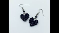 the earrings are made out of black beads