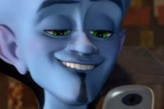 an animated avatar with green eyes holding a cell phone in his right hand and looking at the camera