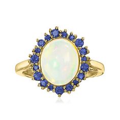 Ross-Simons - Ethiopian Opal Ring, .40ct t.w. Sapphires in 14kt Yellow Gold. Size 8. On this standout statement ring, a dreamy 11x9mm oval Ethiopian opal cabochon is encircled by a rich and velvety halo of .40 ct. t.w. sapphire rounds to create a high-contrast design that's perfectly balanced. Set in sunny polished 14kt yellow gold for a warm, luxurious overall aesthetic. 5/8" wide. Sapphire and opal ring. Opal birthstones are the perfect gift for October birthdays. Elegant Oval Cluster Ring With Cabochon, Elegant Oval Cabochon Cluster Ring, Formal Oval Opal Ring With Gemstone Accents, Classic Oval Opal Ring With Halo, Oval Opal Ring With Gemstone Accents For Anniversary, Classic Halo Opal Ring, Classic Round Halo Opal Ring, Formal Oval Opal Ring With Halo Design, Classic Oval Opal Ring With Halo Design