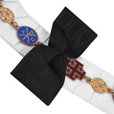 This Red Cross of Constantine Chain Collar is a beautiful and prestigious piece of jewelry that is sure to be a treasured addition to any member's collection of Masonic regalia. It has pure brass gold-plated jewels on a white ribbon backing. The striking design and high-quality materials of this chain collar make it a standout piece that is sure to be admired by fellow members and non-members Features: - Gold Plated- White Ribbon- Excellent Quality Spiritual Brass Jewelry For Commemoration, Classic Antique Gold Metal Jewelry, Elegant Ceremonial Metal Jewelry, Classic Formal Jewelry With Jewels, Classic Ceremonial Brass Jewelry, Classic Jewelry With Gold Clasp For Gift, Luxury Jewelry With Gold Clasp For Gift, Ceremonial Antique Gold Metal Jewelry, Ceremonial Gold-tone Brass Jewelry