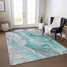 a living room with a chair and rug on the floor