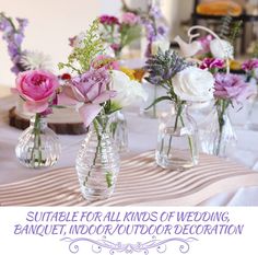 vases filled with flowers on top of a table covered in white and purple cloth