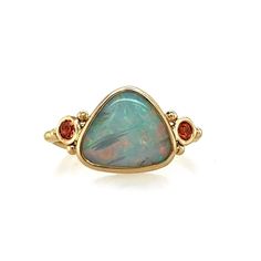 This Opal glows from deep within, from blue to green to pink, purple and orange. Set in 14k yellow gold with the most perfect orangesapphires. Accented with gold beads and Emily's seagrass band. Set in an opened back setting to allow maximum light play to pass through its flashy rainbow. Approx stone size: 12mm x 10mm Approx Ct weight: 1.9 cts Mohs Hardness 6 This piece is handmade to order in Emily's Hudson Valley studio. It is currently a size 7 but can be resized at no charge prior to shippin Orange Sapphire Ring, Australian Opal Ring, Purple And Orange, Orange Sapphire, Local Jewelry, Australian Opal, Hudson Valley, Opal Rings, Gold Beads