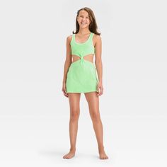 Your kiddo can layer their swimsuit while lounging on the beach or returning home from their swim session with this Solid Terry Cover-Up Dress from art class™. This sleeveless cover-up dress in a solid color features a center knot detail along with cutout sides and back for a stylish, breezy look. The cotton-blend terry fabric offers a cool and comfortable fit, while the pullover style allows for easy wear. Plus, the UPF 50+ rated finish offers added protection from UV rays. Welcome to art class Summer Beach Tankini, Summer Beach Season Tankini For Play, Summer Beach Tankini For Playwear, Summer Tankini For Beachwear, Playful Spring Tankini, Spring Beachwear Swimwear For Play, Summer Beachwear Tankini For Playwear, Playful Sleeveless Tankini For Beach Season, Summer Sleeveless Tankini For Play