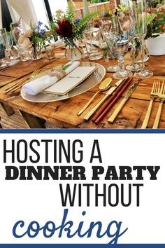 a dinner party is set up on a wooden table