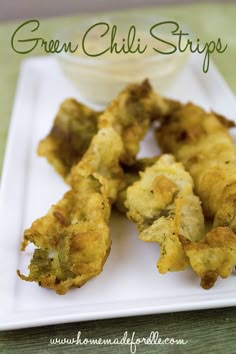 fried green chili strips on a white plate with dip in the middle and text overlay that reads, green chili strips